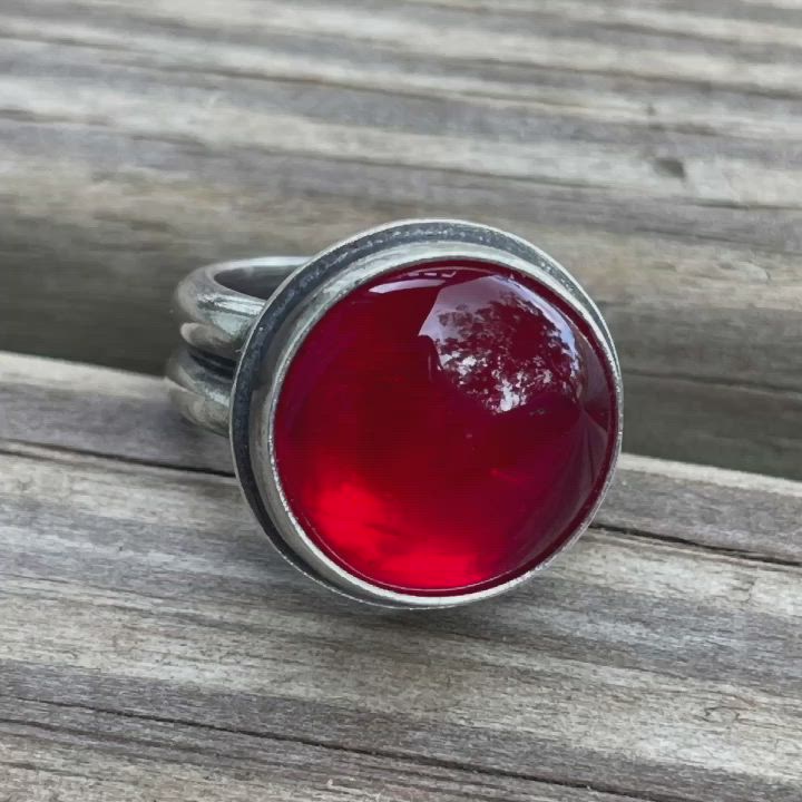 This ring will capture your heart at first sight with it's bright red glow! I have bezel set this round Rosarita stone in a handmade sterling silver setting. The band is a double wide dome which offers a super comfortable fit. The silver has been antiqued and polished for added depth a beauty.