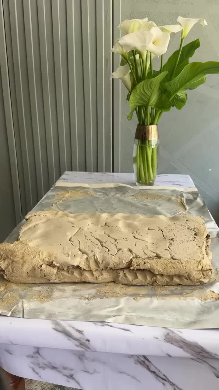 This may contain: a person is cutting up some food on a table with scissors and plastic wrappers