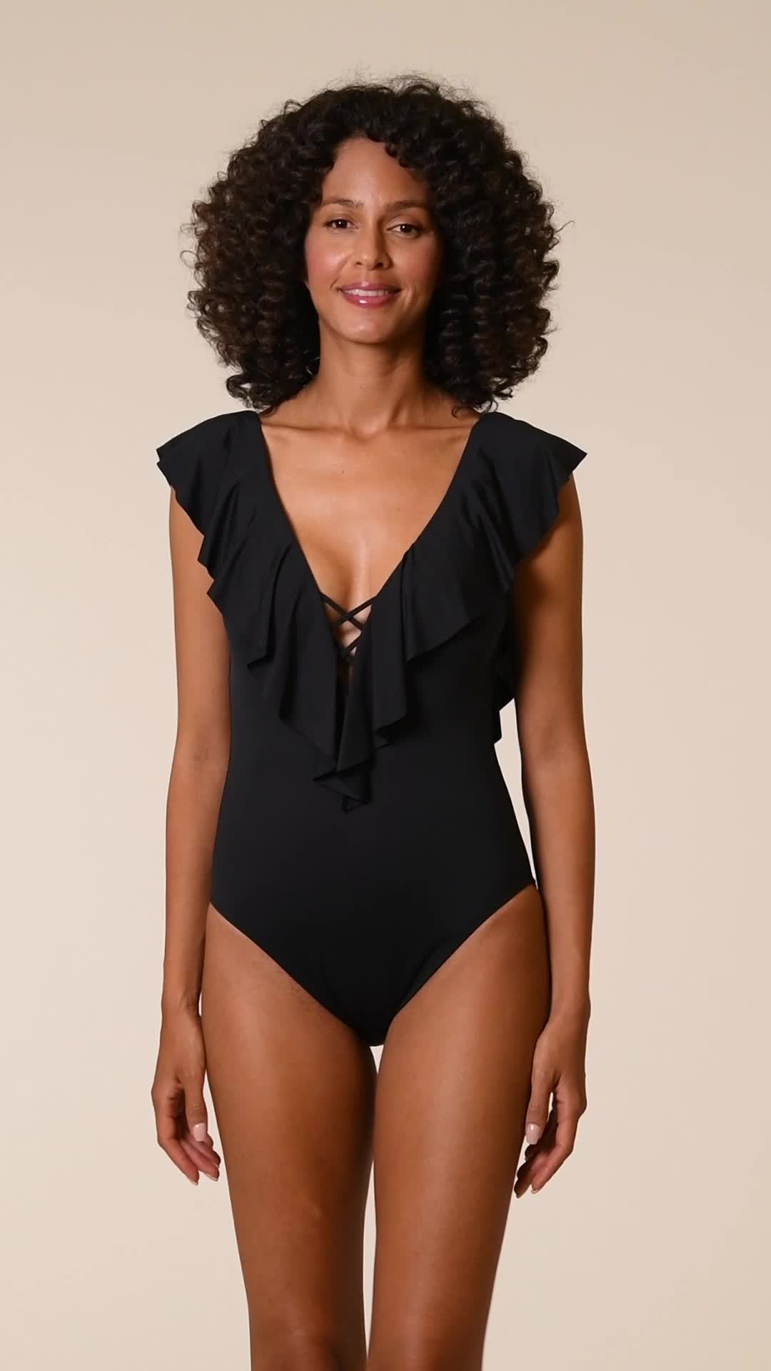 Equally parts sexy and sweet, this one-piece swimsuit features a plunging neck and back trimmed with romantic ruffles. Built-in tummy control and moderate coverage in the rear provides a confident fit. Detail we love: crisscrossing details at the center that keep the suit from revealing more than you want. [split] Details One-piece suit Deep plunging neck and back Over-the-shoulder straps Removable cups Crisscrossing strappy details Built-in tummy control Moderate rear coverage Fabric 83% Nylon,