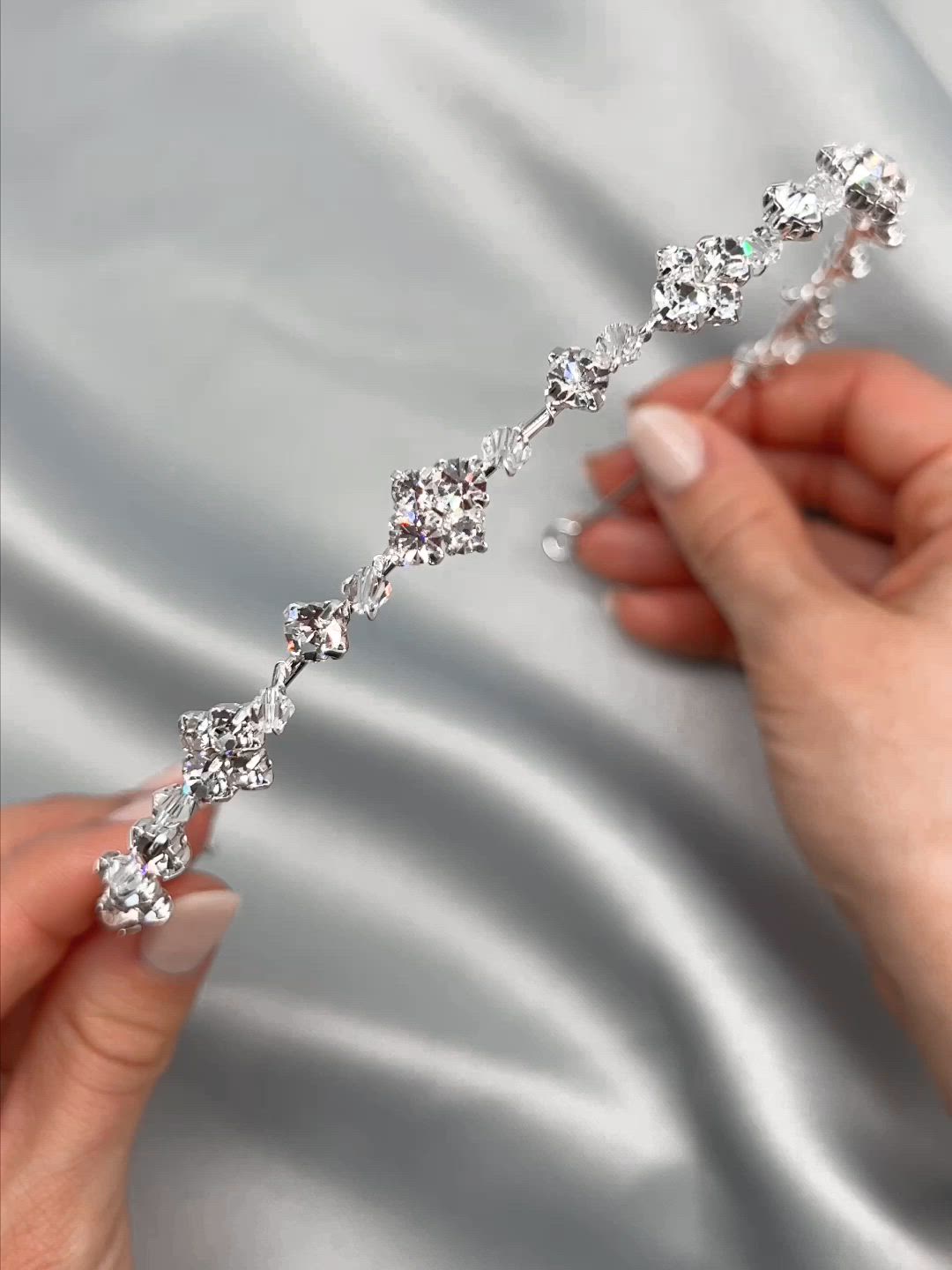 Perfect for your little white dress or ceremony gown, our Catalina Headband is a delicate dainty accent for your wedding hair. Designed with crystal gemstone & bead clusters alternating along a minimalist style headband. You'll be able to wear this again & again. Crystal gemstones & beads Measures 0.75" Pin loops are located at each end Style #3449