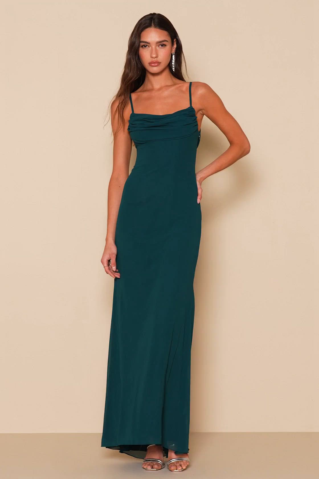 All eyes will be on you in the Lulus Captivated Emerald Green Cowl Neck Maxi Dress! Sheer chiffon covers a lightly padded bodice, supported by adjustable spaghetti straps, while gathered fabric creates a cowl neckline and draping back. Figure-skimming silhouette flows into a full maxi skirt with a mermaid hem. Hidden side zipper/clasp. Fit: This garment fits true to size. Length: Floor length. Size 8 measures 46" from adjustable straps to hem. Bust: Great for any cup size. Waist: Fitted - very f