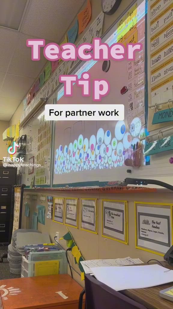 This may contain: a teacher's tip for partner work is displayed on the wall in this classroom