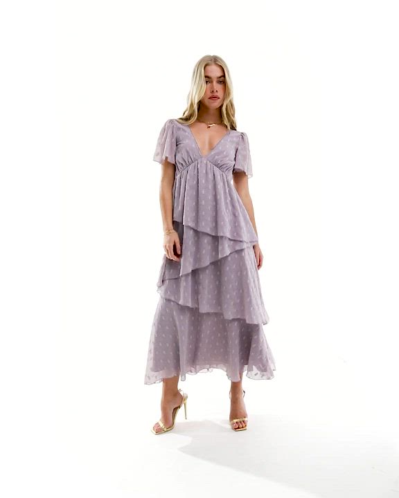 Dresses by ASOS DESIGN Dress the part V-neck Flutter sleeves Asymmetrical ruffle details Tie-back fastening Regular fit