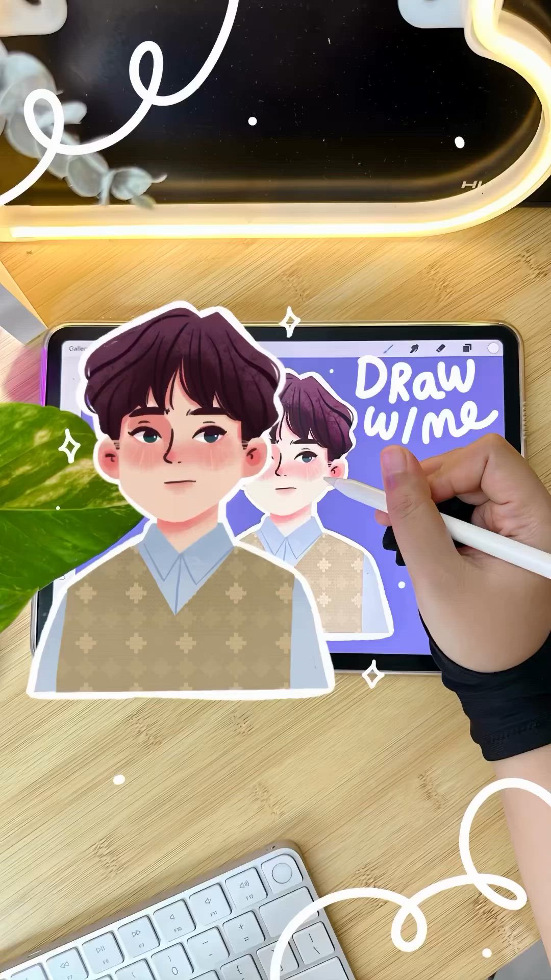 This may contain: a person is drawing on a tablet with a sticker next to it and a plant in the background