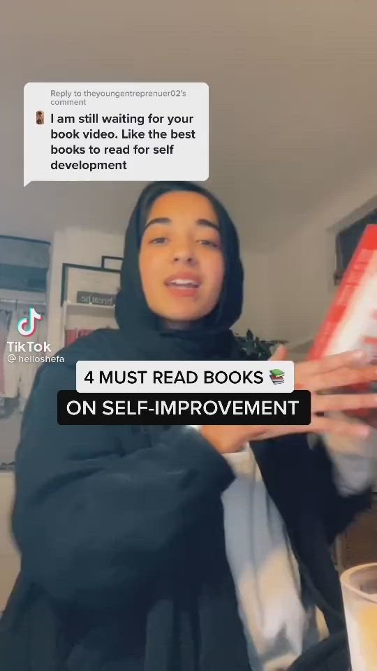 This may contain: a woman holding up a book in her hands with the caption'i am still waiting for your books to read for self improvement '