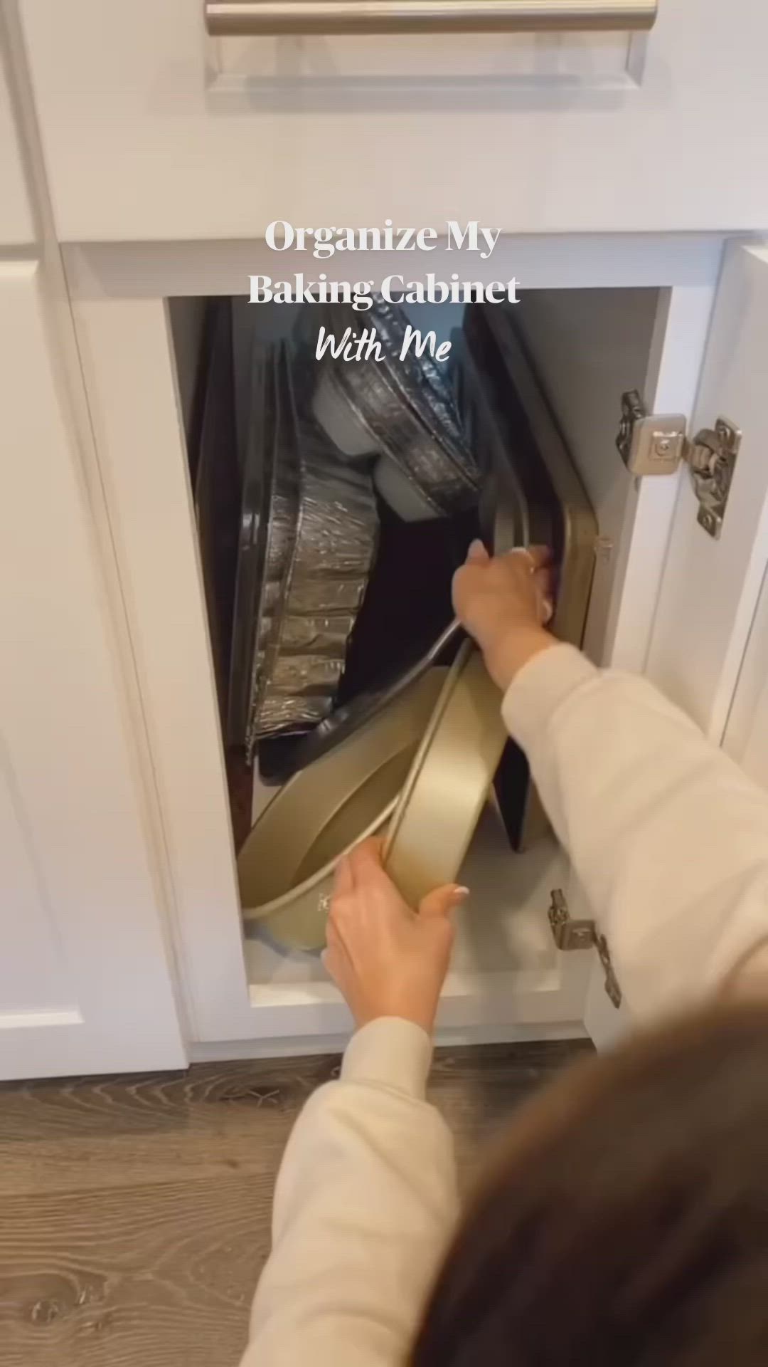 This may contain: a woman is opening the oven door with her hand