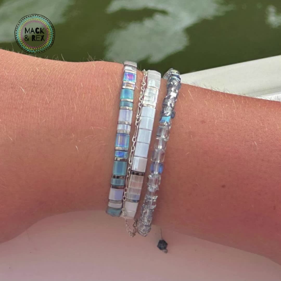 Add a touch of icy coolness to your style with the River of Ice Tila Bead Bracelet Stack (includes 3 bracelets). With shimmering Tila beads in shades of blue and silver, this bracelet stack is perfect for any occasion. Let your style flow like a river with this unique bracelet set!