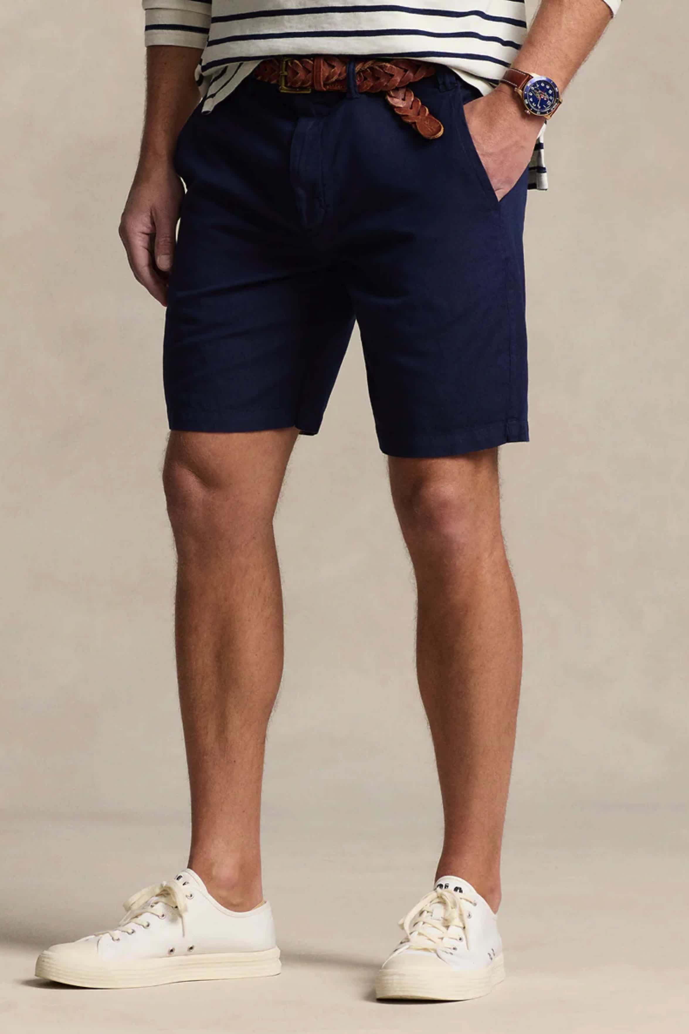 Elevate your summer wardrobe with the Maritime Classic Fit Short in Newport Navy. Made from a luxurious cotton-and-linen blend, these shorts provide lasting comfort and breathability. Ideal for outdoor activities, they are perfect for the stylish and refined individual. #summeressentials #maritimeclassicfit #breathableshorts