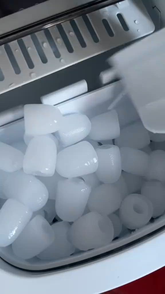 This may contain: an image of ice cubes being processed in a machine