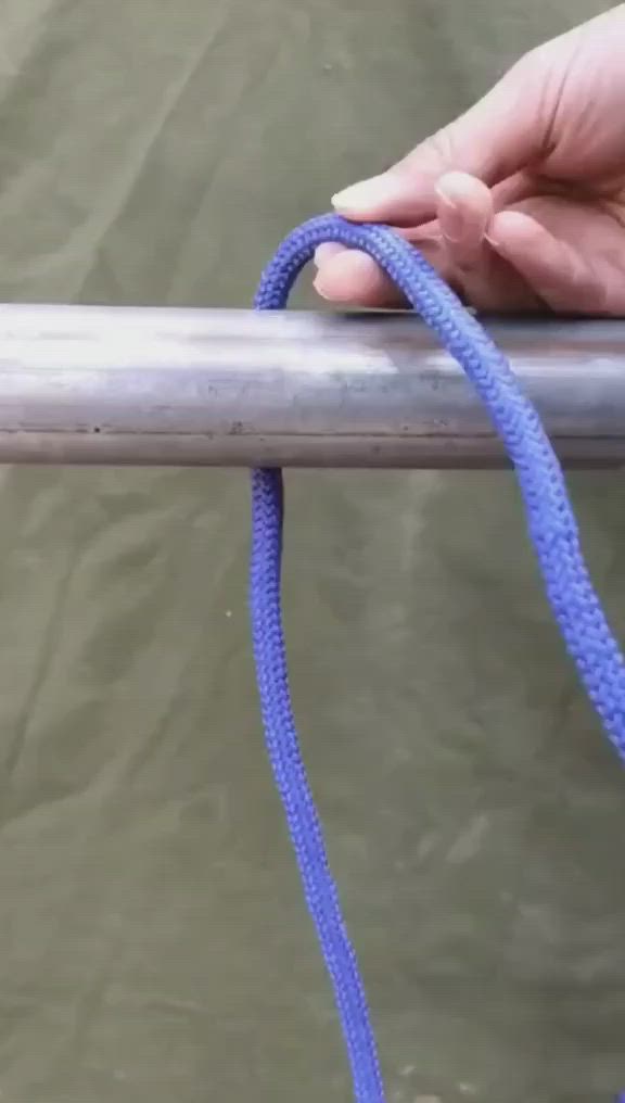 This may contain: a person is holding on to a blue rope