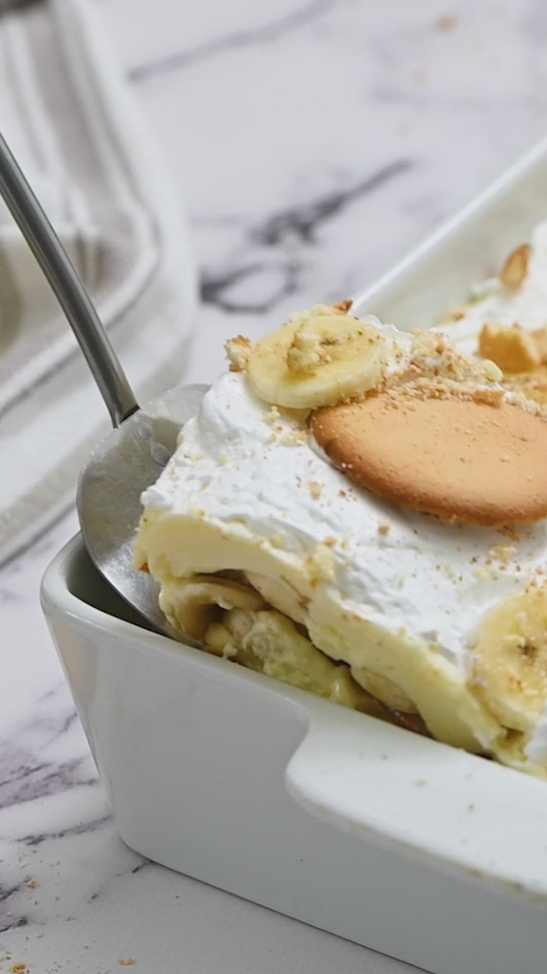 This contains: video tutorial showing how to make Layered Banana Pudding