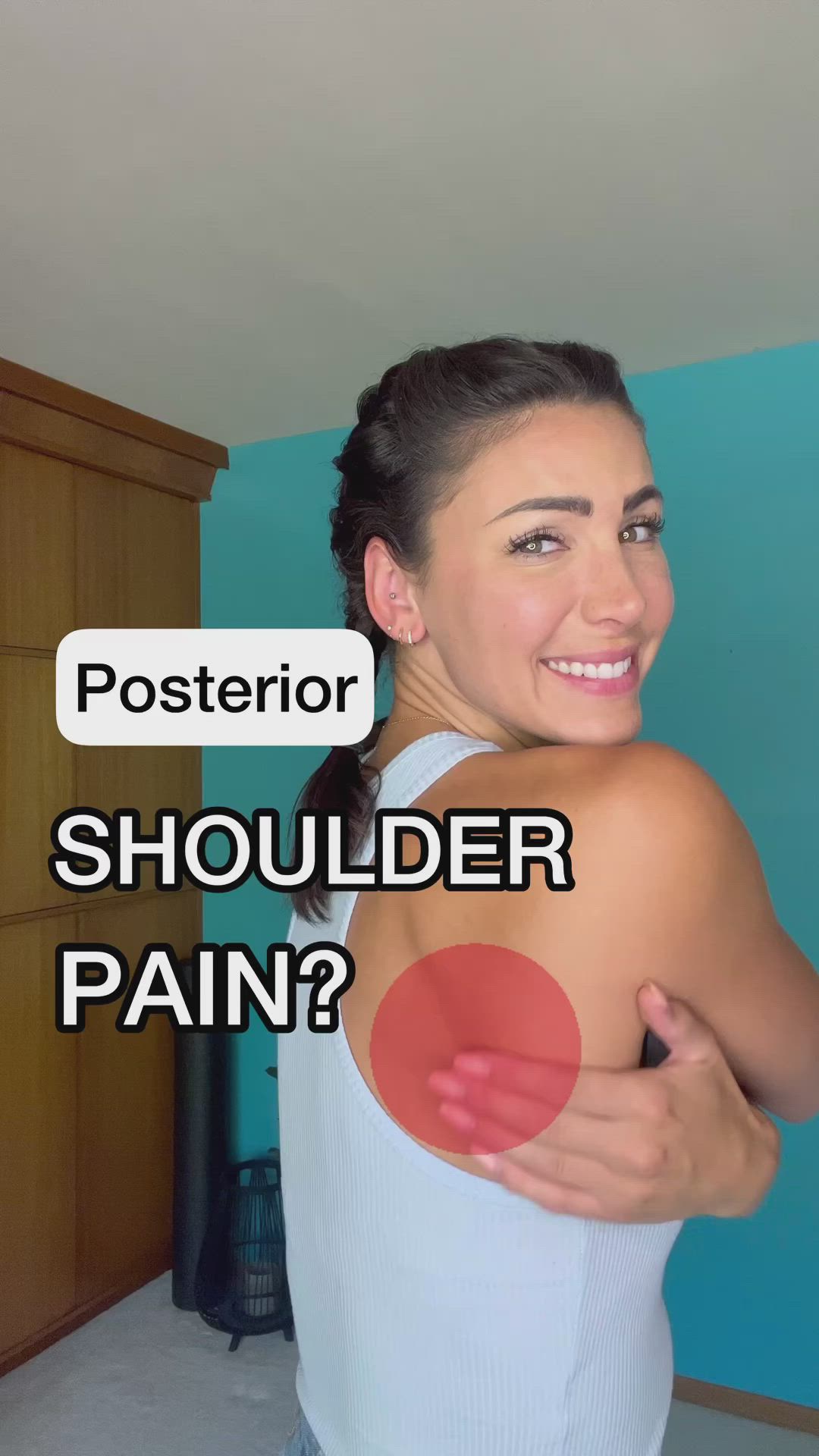 This may contain: a woman with shoulder pain and the caption reads, posterior shoulder pain?