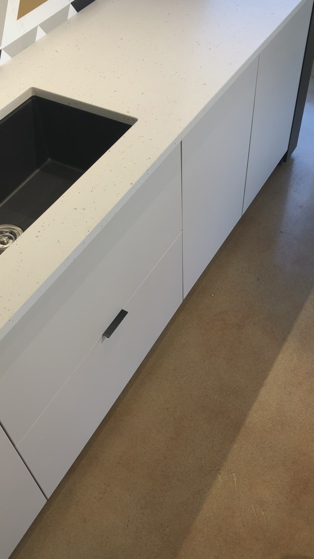 This contains: u-shaped sink drawer cabinet by Superior Cabinets.