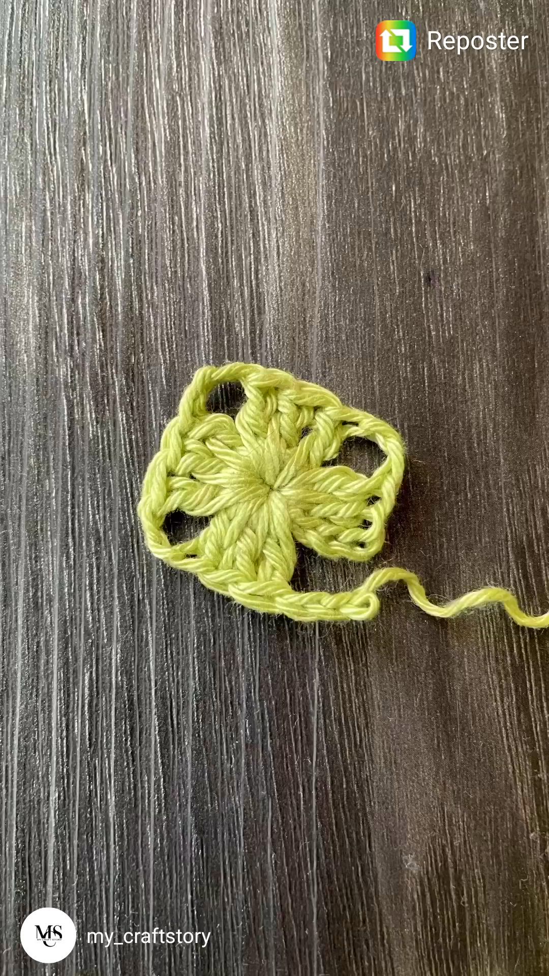 This may contain: three crocheted hearts sitting on top of a table