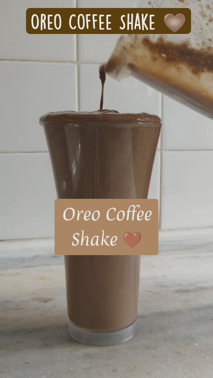 This may contain: coffee shake being poured into a cup with the words oreo coffee shake on it