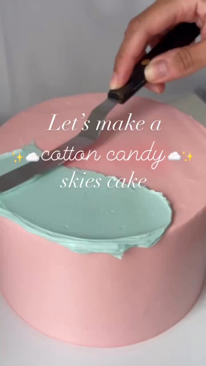 This may contain: a person cutting into a cake with a knife on it's pink icing