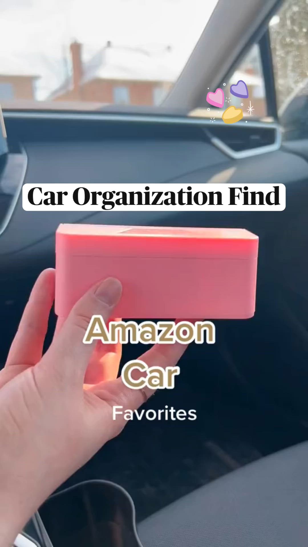 This may contain: someone is holding an amazon car box in their hand and it's inside the car