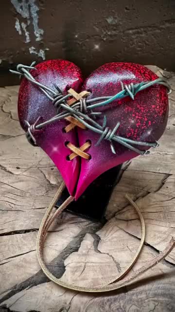 This may contain: two pieces of fruit with barbed wire attached to them