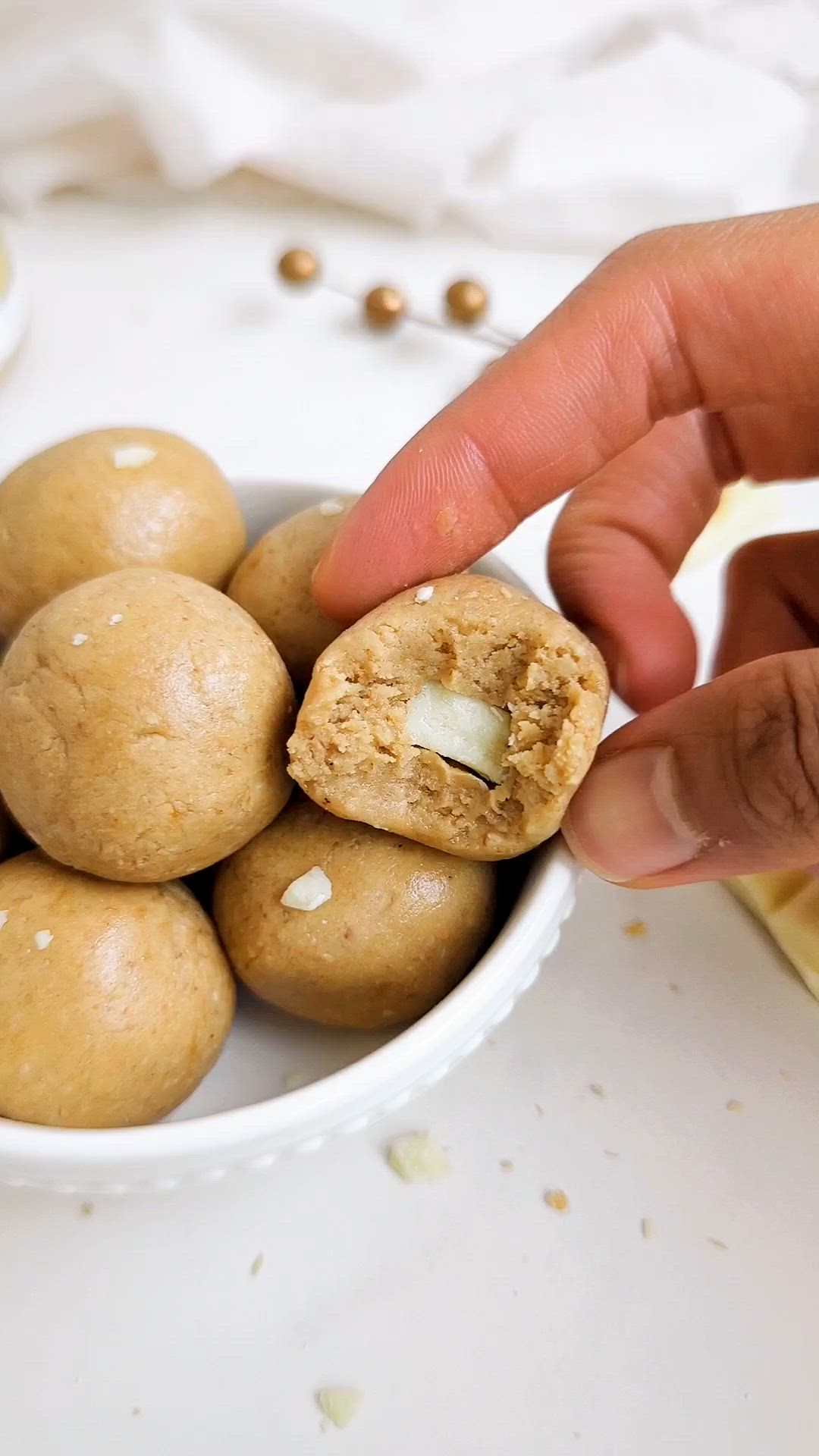 This contains: Maple White Chocolate Protein Balls are delightful, indulgent and good-for-you at the same time! With sugar-free white chocolate and maple syrup, protein powder and maple-flavored cashew butter, these bites will have you swooning!