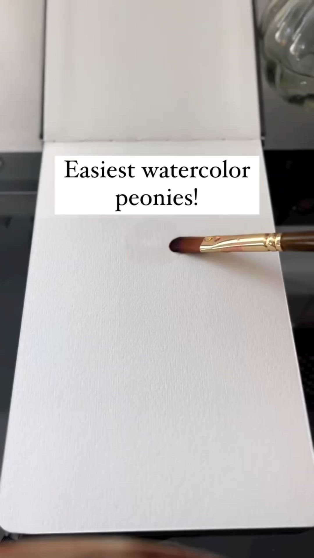 This may contain: an easel watercolor pen sitting on top of a white piece of paper with the words easiet watercolor peonies