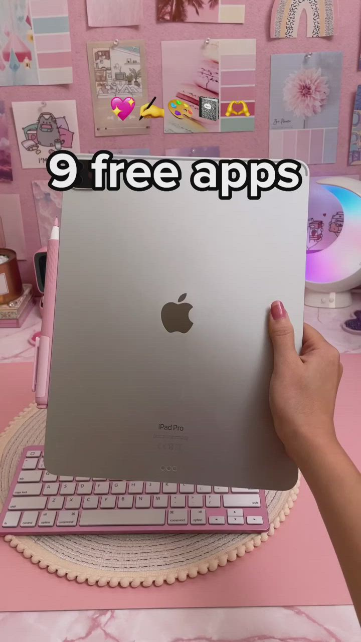 This may contain: a person holding an apple laptop with the text, 9 free apps on it in front of a pink background