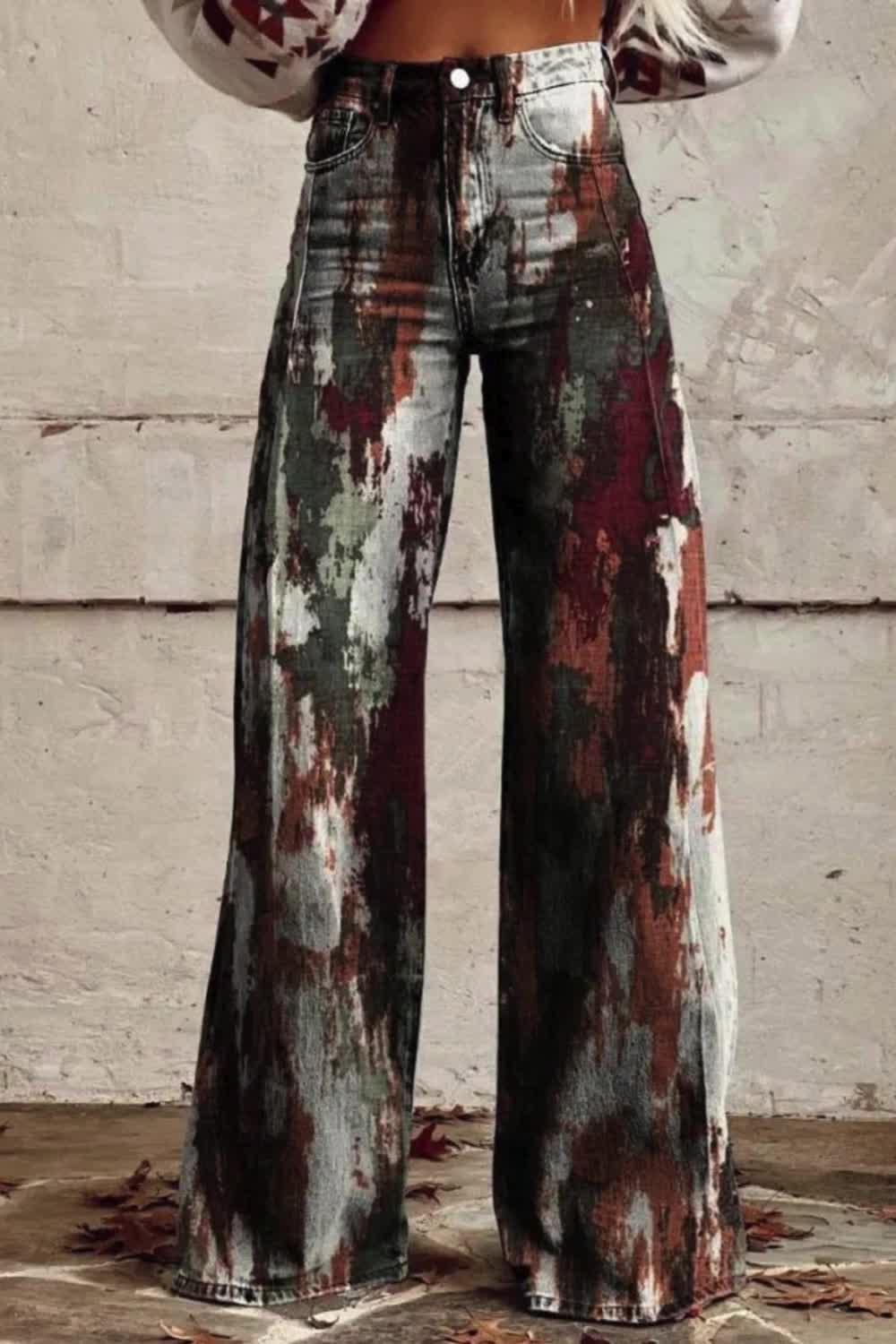 Infuse your wardrobe with bohemian charm in these women's wide-leg pants adorned with a captivating rust print. Effortlessly stylish and comfortable, they offer a relaxed yet fashionable look for any occasion. Perfect for those who appreciate eclectic and free-spirited fashion.