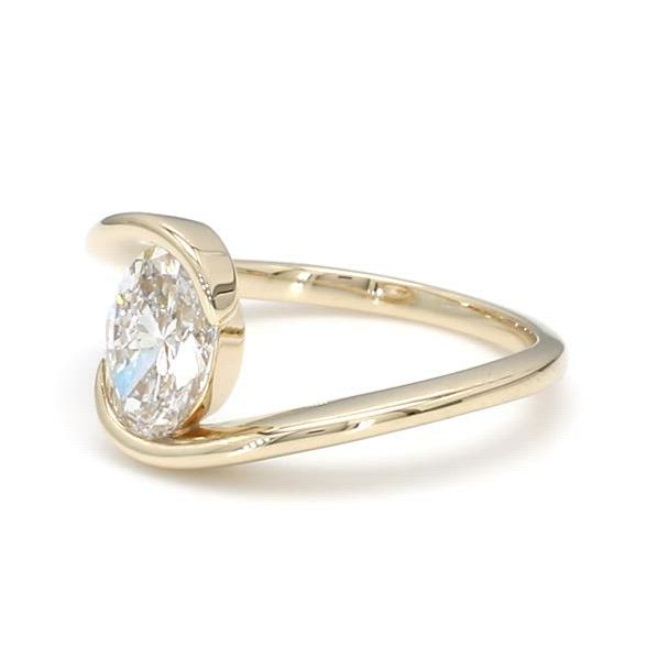 This contains: This unique solitaire engagement ring is a work of art. Sandrine features a bypass style setting that mimics the aesthetic of a tension band, while providing the practicality & protection of a semi-bezel setting. Any shape diamond can be set into this setting.