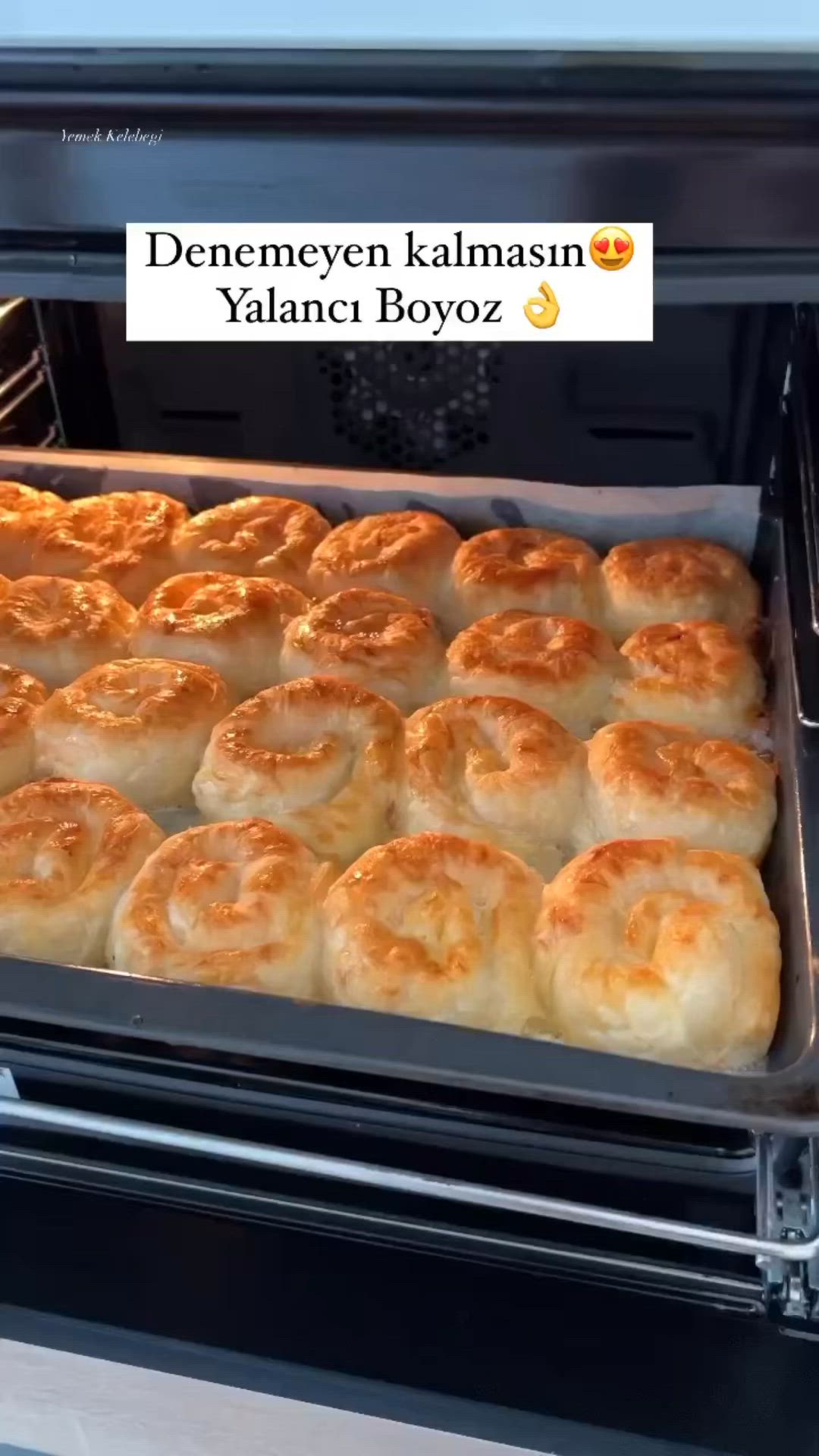 This may contain: there are many rolls in the oven ready to be baked