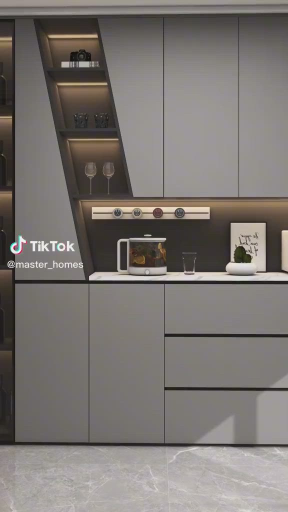 This may contain: a modern kitchen with grey cabinets and white counter tops, built into the side of a wall