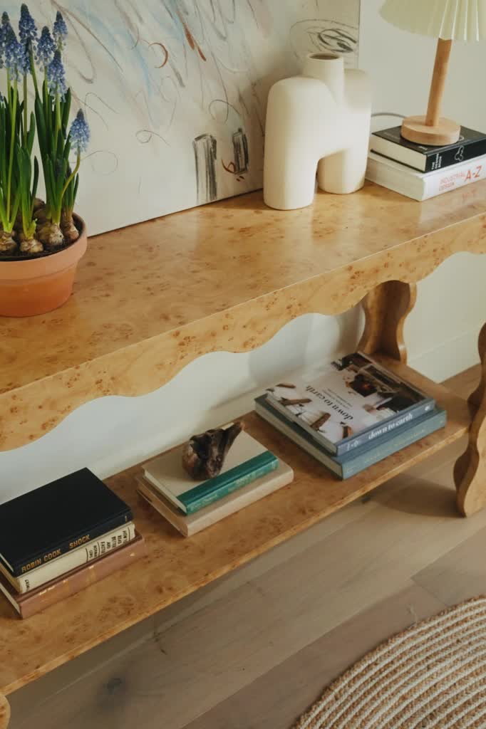 A modern statement piece, this console table is characterized by a trendy faux burl design and playful scallop edging. The open bottom shelf adds both style and functionality to this stunning piece. Pair with the Camden Side Table to complete the look. Contemporary design Faux burl Scallop edging Bottom shelf Assembly required, hardware included