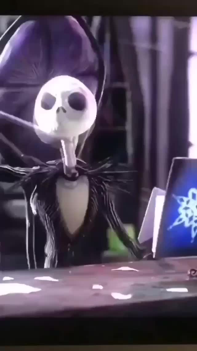 This may contain: an animated skeleton sitting at a desk in front of a computer screen