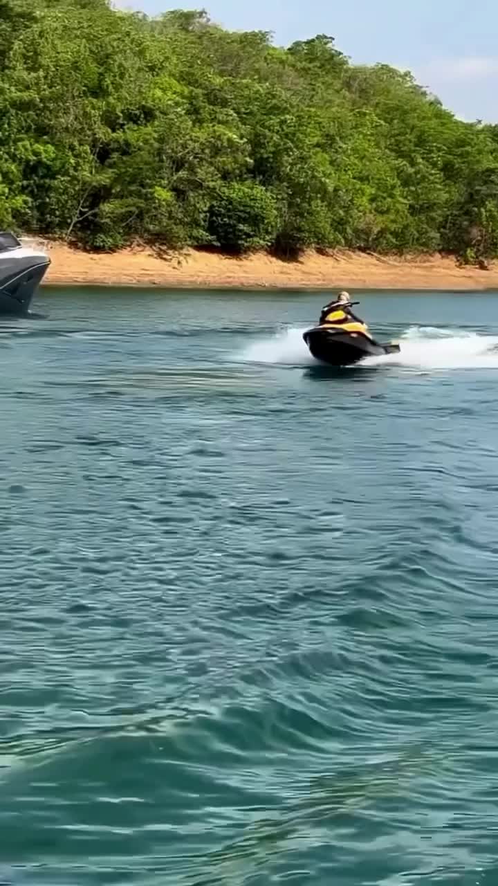 This may contain: a person on a jet ski in the water