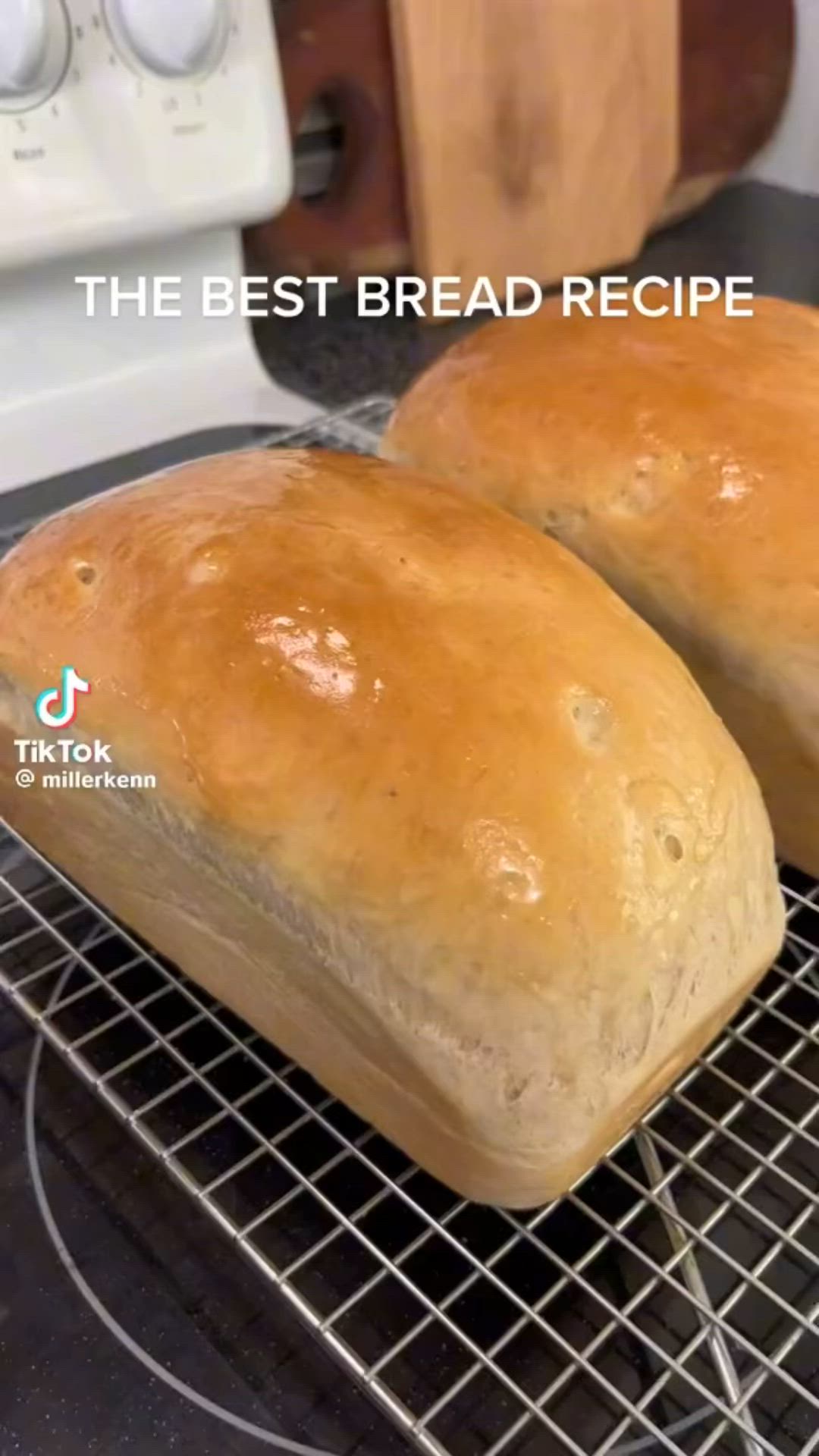 This may contain: two loaves of bread sitting on top of a cooling rack