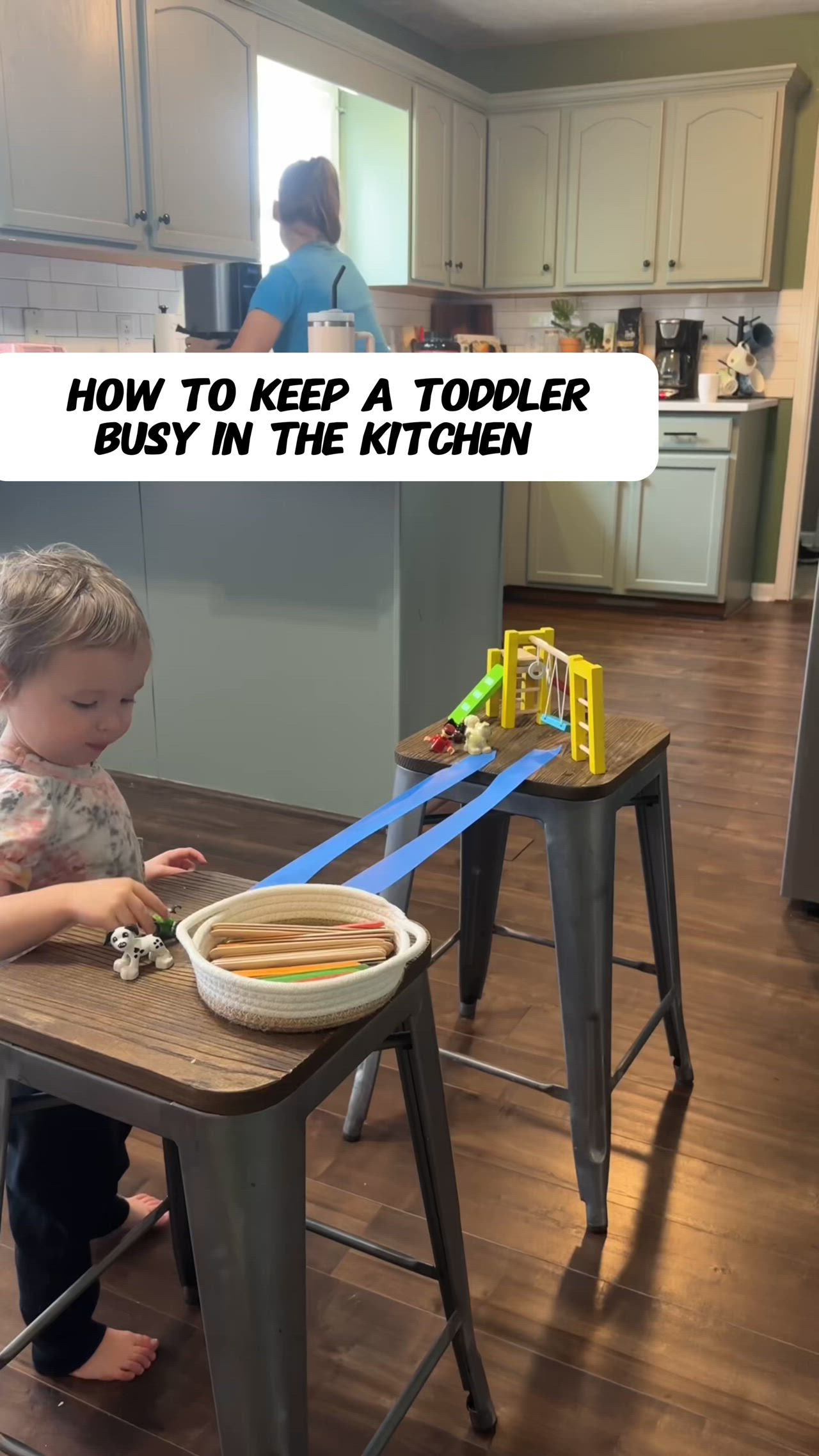 This contains: how to keep a toddler busy in the kitchen - toy bridge activity