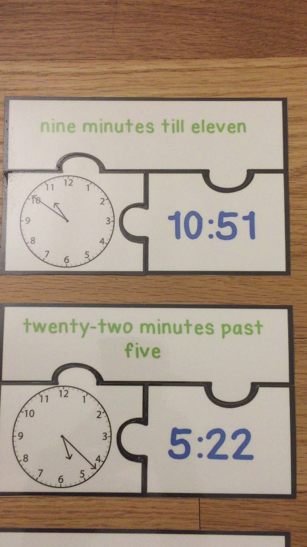 This may contain: four pieces of puzzle with numbers and time on them, sitting on a table next to each other