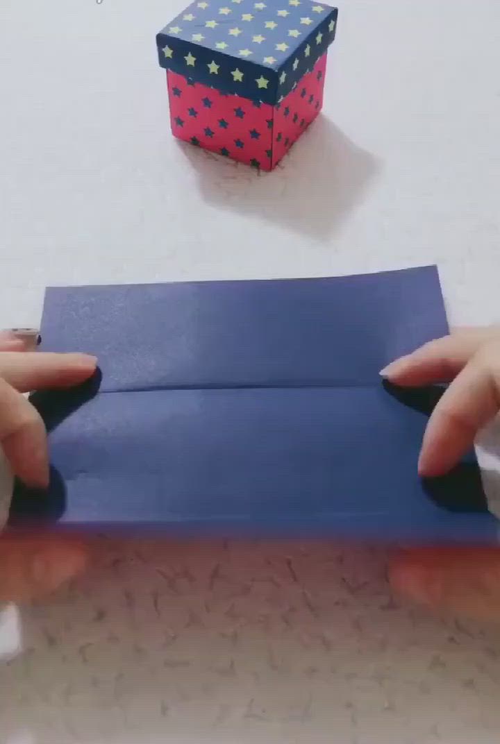 This may contain: two hands are holding some paper with dots on it