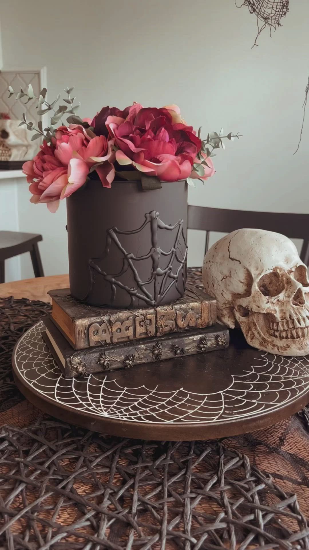 This may contain: a table topped with a skull and flowers