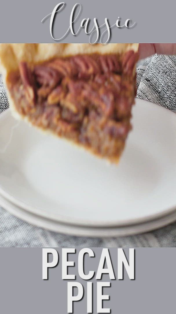 This may contain: a piece of pecan pie sitting on top of a white plate