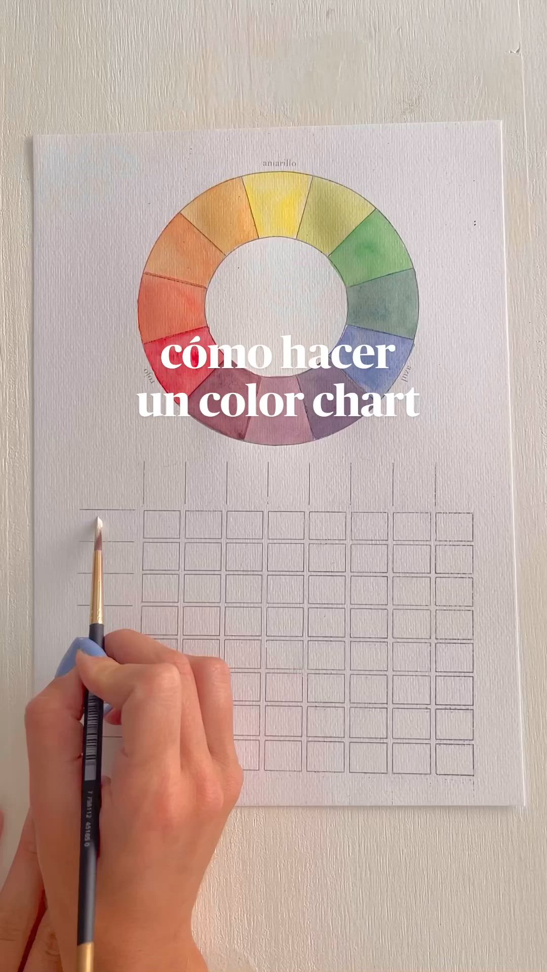 This may contain: a woman's hands with blue nail polish on top of a color chart paper