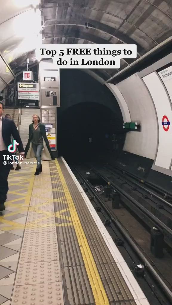 This may contain: two people are walking down the platform in a subway station, with text overlaying top 5 free things to do in london