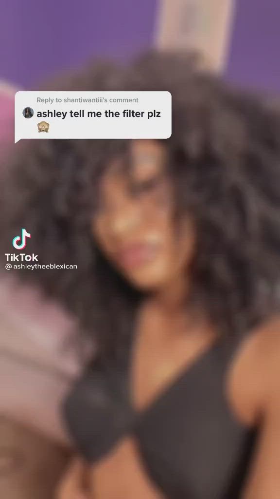 This may contain: an image of a woman with curly hair on her cell phone and the caption says, sahey tell me the filter piz