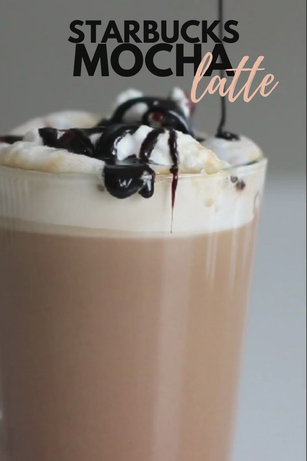 This may contain: a close up of a drink with whipped cream and chocolate