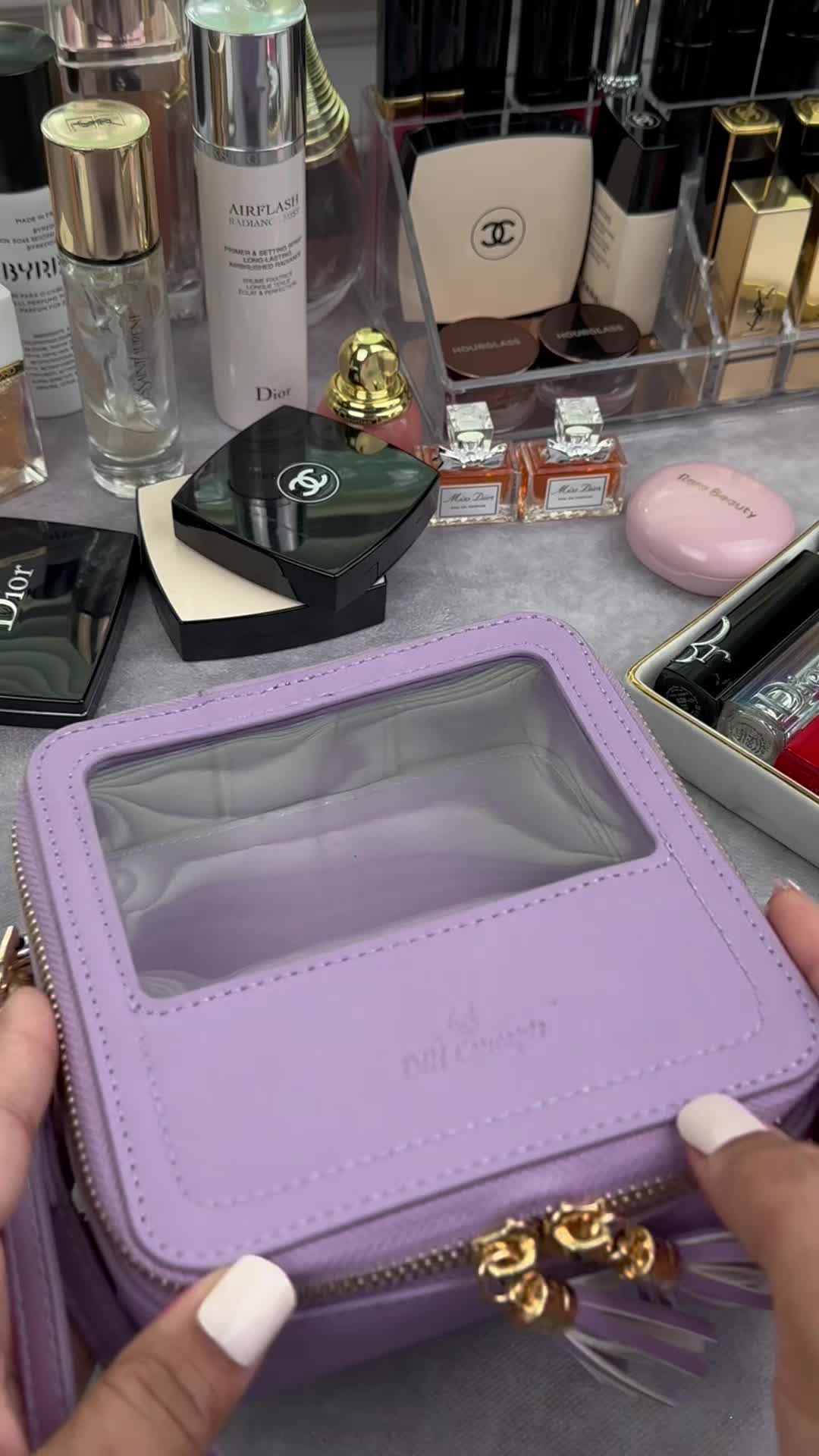 Pack my makeup in a cute lilac wristlet case