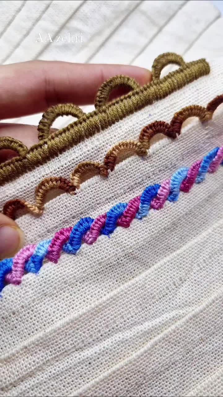 This may contain: someone is stitching together with different colored threads