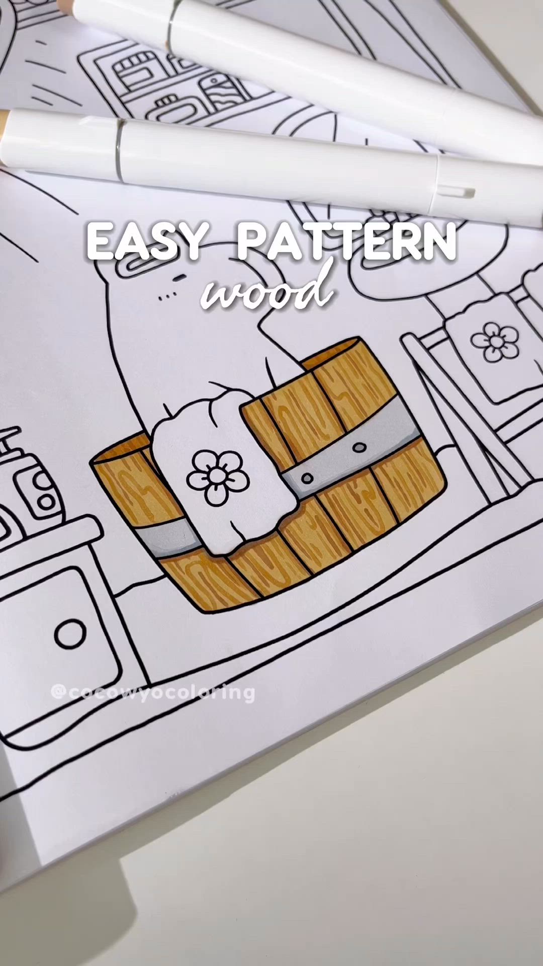 This may contain: an easy pattern is shown on the cover of a coloring book, which features a basket and flowers