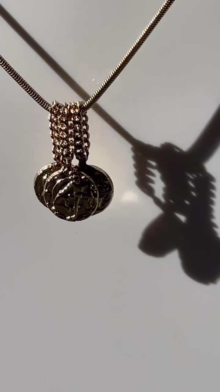 A tactile dream. Featuring a Zodiac coin motif... meet the K&J Chain Bail. Slinky & sturdy this diamond-cut curb chain bail adds dimension and a smooth slide to your stack. Pair with a snake chain or thicker chain for a tangle free experience. It stacks, slides and sparkles.