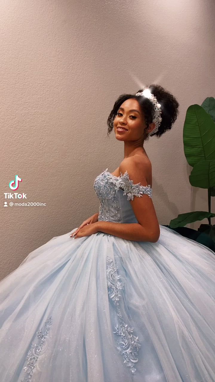 This contains an image of: Cinderella themed off the shoulder blue quince dress