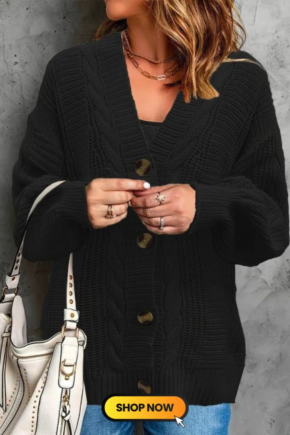 Elevate your winter wardrobe with our Button Front Cable Knit Cardigan. The classic design, featuring a V-neck and long sleeves, exudes timeless charm. The intricate cable knit adds texture, while the button front allows for versatile styling. Embrace warmth and style effortlessly in this cozy and chic essential.