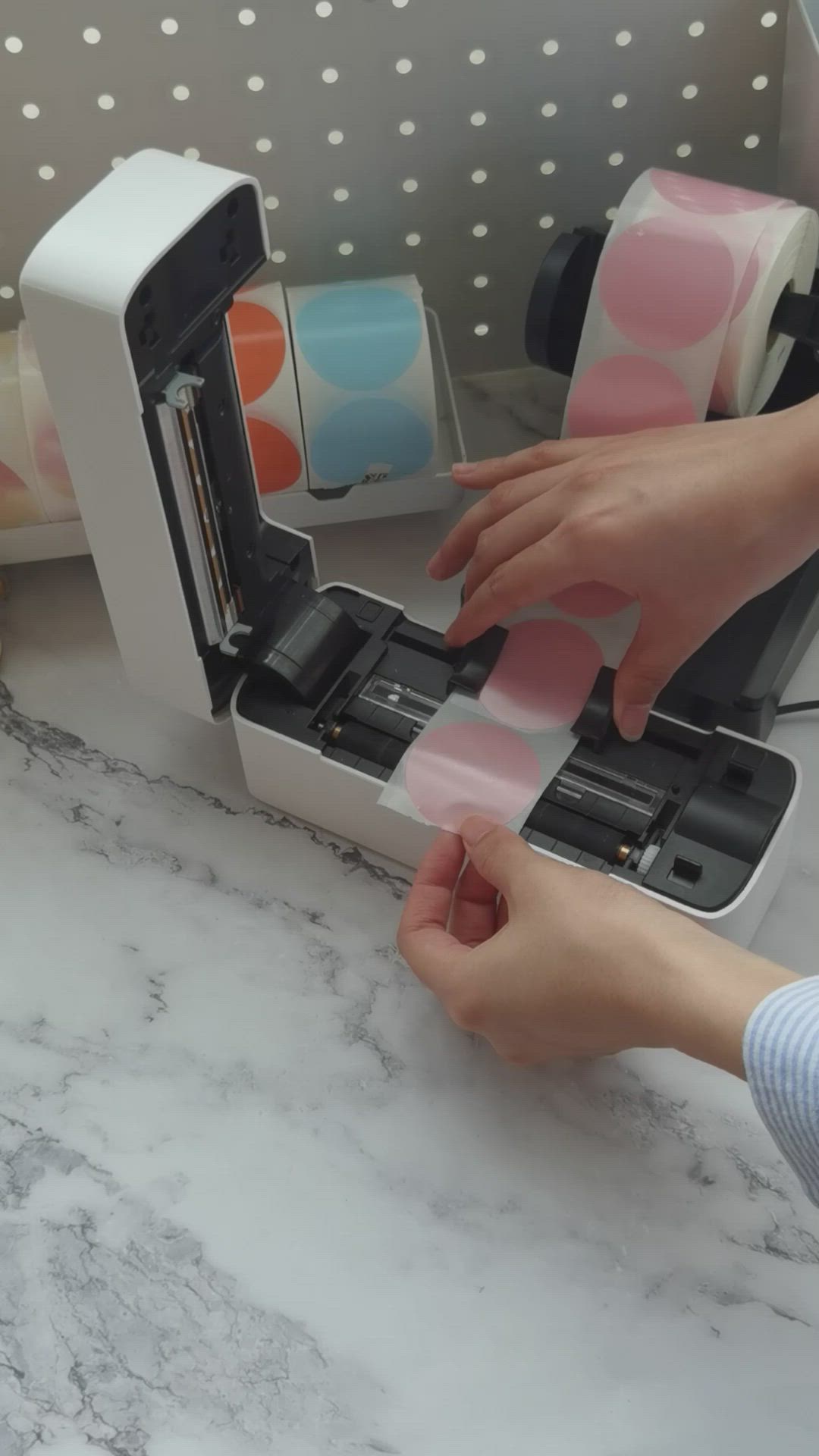 This may contain: a person using a machine to make wash paper