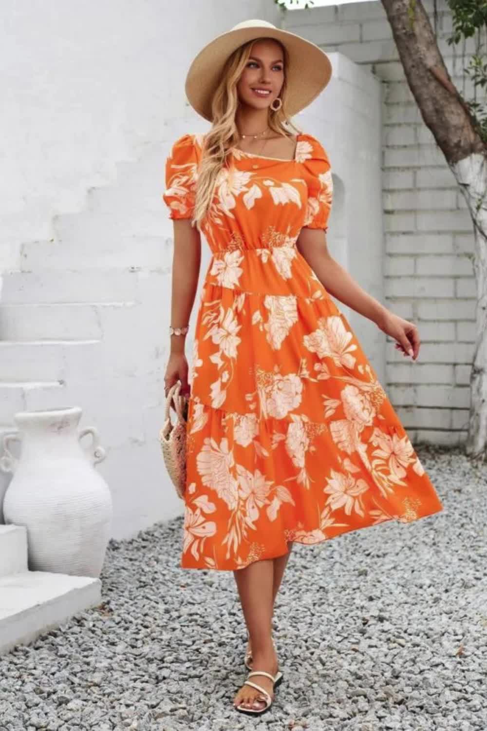 "Elevate your wardrobe with our Printed Asymmetric Neck Short Sleeve Midi Dress. Featuring a stylish asymmetric neckline and vibrant print, this dress blends modern design with flattering comfort, ideal for any occasion."